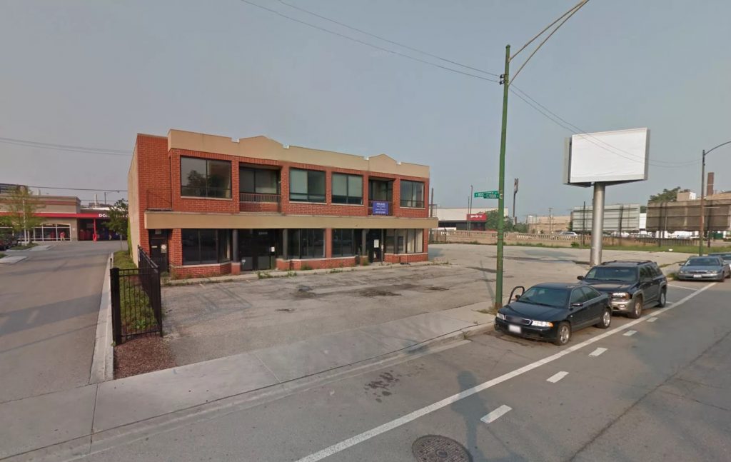 The existing site -- a closed Kinkos store (Google Street View)